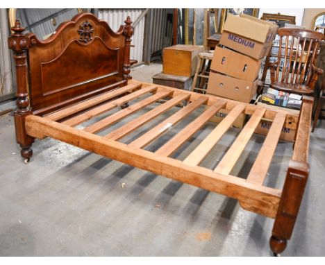 A Victorian mahogany bed,&nbsp;the headboard with ceramic castors, pine frame, 152cm w  Generally good. Some wear.