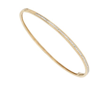 A diamond bangle, in gold, 64mm (internal), marked 750, 8.7g  Good condition