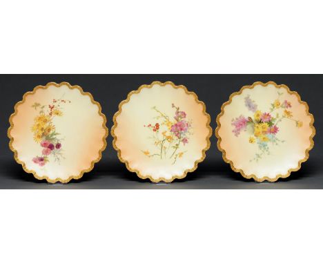 A set of three Royal Worcester dessert plates, 1897, printed and painted with wildflowers on a shaded apricot ground, 21.5cm 