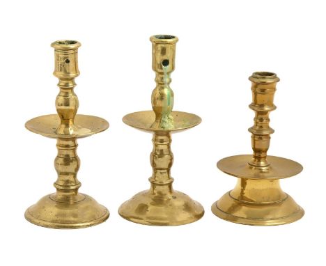 A Northern European brass candlestick, 18th / 19th c, 15.5cm h and two brass Heemskerk type candlesticks (3)  Good condition