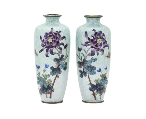 A pair of Japanese ginbari cloisonne enamel vases, Meiji period, decorated with chrysanthemums and butterfly on a shimmering 