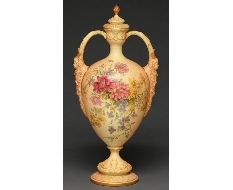 A Royal Worcester vase and cover, 1909, with mask handles and printed and painted with flowers on a shaded apricot ground, 43