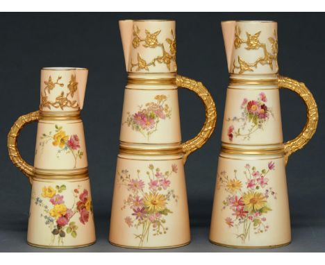 One and a pair of Royal Worcester claret jugs, 1898 and 1908, printed and painted with flowers on a shaded apricot ground, 20