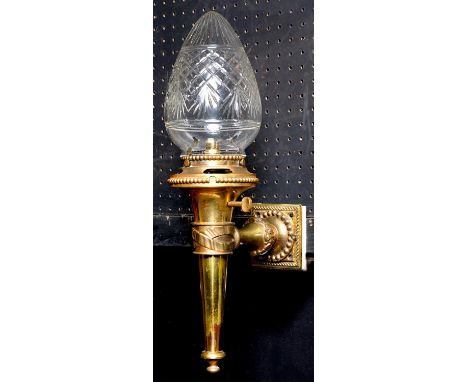 A Victorian brass gas wall light and cut glass shades of torch form, c1900, beaded rims, 44cm h, adapted for electricity  Goo