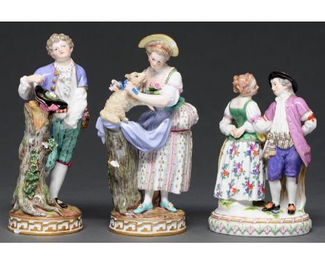A pair of Meissen figures of a youth and shepherdess, late 19th c and a Meissen group of dancers on oval base, 20th c, 18 and
