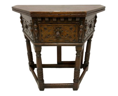 17th century design oak Credence side table, hinged top with rear gate-leg, canted front with strapwork decoration and centra