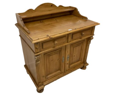 20th century pine side cabinet, raised shaped back with shelf over moulded rectangular top, two drawers over two panelled cup