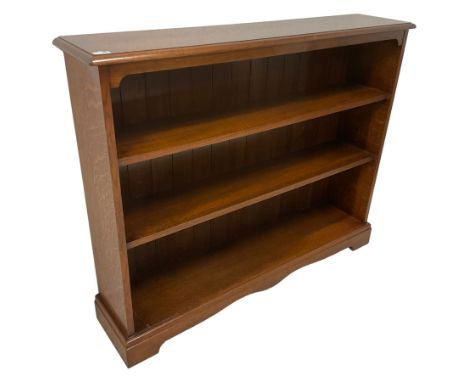 20th century solid oak open bookcase, fitted with two shelves, raised on bracket feetDimensions: Height:&nbsp;103cm&nbsp; Len