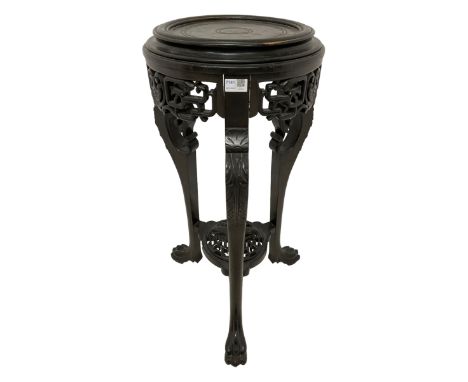 Chinese ebonised hardwood jardiniere or lamp stand, circular top with moulded edge, pierced and carved frieze with interlocki