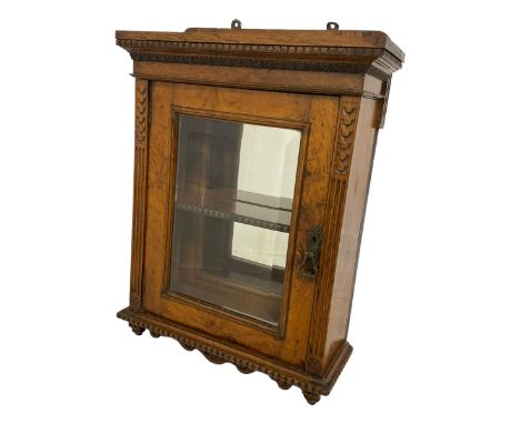 Late Victorian pollard oak wall hanging cabinet, projecting moulded cornice carved with egg and dart, bevel glazed single doo