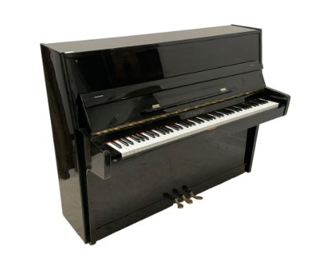 Steinhoff - compact black lacquered upright piano, iron overstrung frame and over damper action with a una corda, sustain and