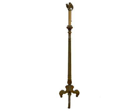 Italian design green painted and parcel gilt standard lamp, four branch fitting over fluted column, three splayed and scroll 