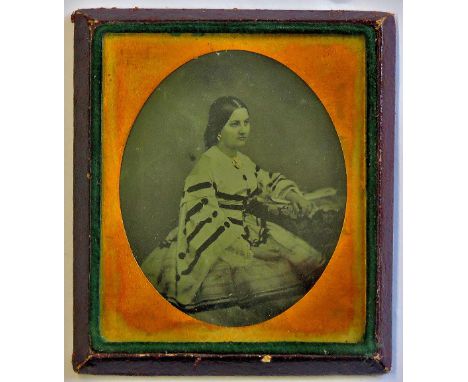 Ambrotype - A leather cased miniature frame. Black and white portrait of a seated lady. Excellent quality.