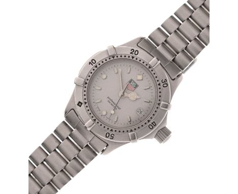 Tag Heuer - Lady's Professional stainless steel wristwatch, having a matte grey dial with luminous filled hour markers and ha
