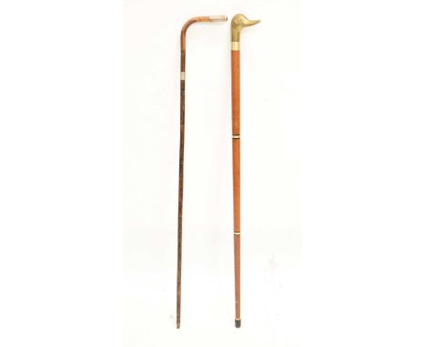 Reproduction gilt metal duck 'toper' walking stick, together with an early 20th century silver-mounted and bamboo cane, 88cm 