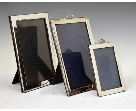 Two silver mounted picture frames with ribbon decoration, sponsor's marks of Henry Matthews, Birmingham 1912 and 1914, 25.5cm
