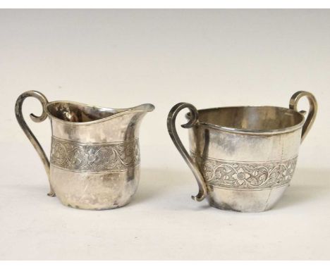 Middle Eastern white-metal jug and sugar basin with engraved decorative band, 8.5cm high, 283g approx
