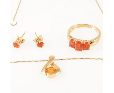 A suite of Mexican fire opal jewellery, the ring having three oval opals slightly graduated in size, claw set in an all yello