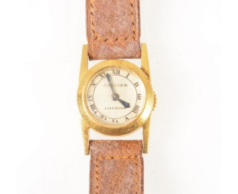 Cartier - a lady's 18 carat yellow gold wrist watch, circular cream dial with roman numeral chapter ring and signed Cartier L