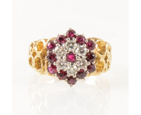 A vintage ruby and diamond circular cluster ring, thirteen rubies and six brilliant cut diamonds claw set in an 18 carat yell