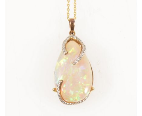 An opal and diamond pendant and chain, the pear shaped cabochon cut opal 20mm x 13mm, held by long claws set with thirty-two 