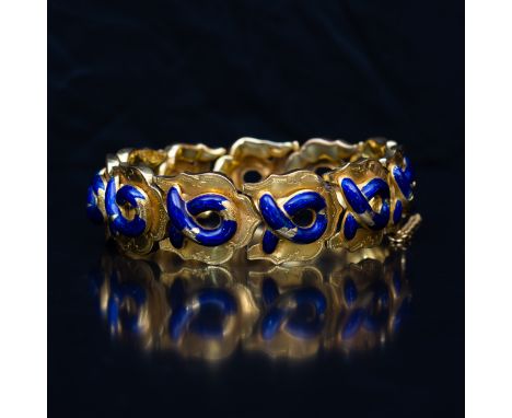 A mid 19 th Century yellow metal and enamel bracelet, the eleven links each mounted with a blue enamelled hoop and fine etche