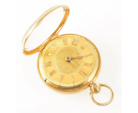 A small 18 carat yellow gold open face pocket watch, the gold coloured dial with an engine turned centre and having a Roman n