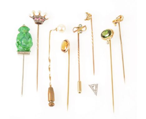 Eight gemset tie pins and another triangular tie pin top, a coronet set with five seed pearls, three rubies and fourteen rose