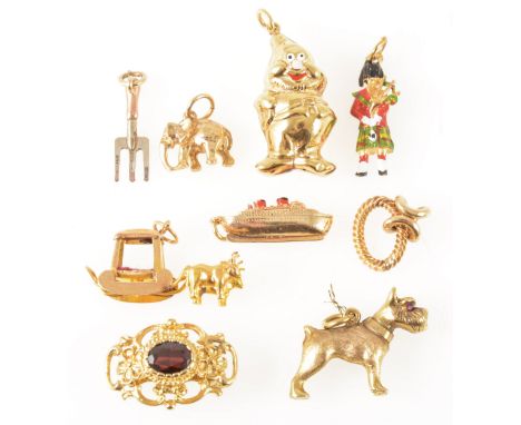 Eight various gold and yellow metal charms and a necklace fastener, mostly 9 carat gold, an enamel piper and ship, dog, eleph