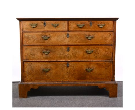 A George II walnut chest of drawers, the rectangular top with herringbone stringing, fitted two short and three long drawers,