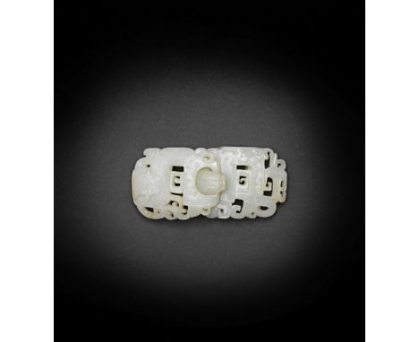 A very pale green jade archaistic belt buckle18th/19th centuryFormed as in two sections, each pierced and carved in low relie