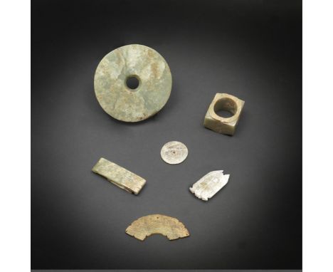 Six early jade carvingsWestern Zhou/Han DynastyComprising a smoothly-carved bi-disc, the stone of pale green tone with mottle