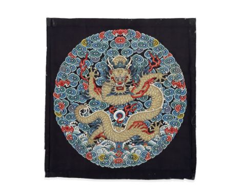 AN EMBROIDERED IMPERIAL SILK 'DRAGON' ROUNDEL, BUZIEarly 19th century The circular badge finely embroidered depicting a front