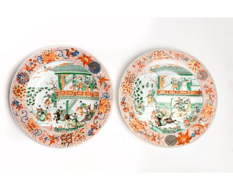 A PAIR OF LARGE VERTE-IMARI CHARGERSKangxiEach brightly enamelled with the Yang family female generals practising their eques