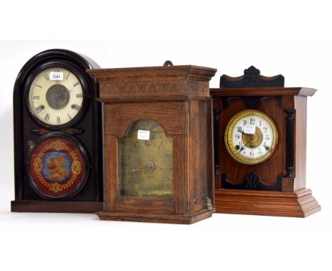 English oak and ebonised two train mantel clock with alarm, the 4.5" white chapter ring and movement back plate signed Fattor