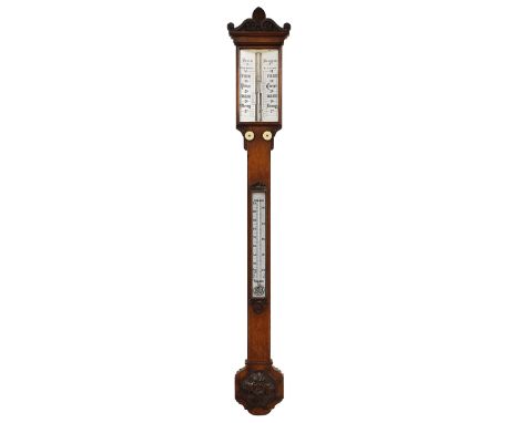 Oak stick barometer, the angled scale signed Boxell, Brighton, over a flat trunk fitted with a thermometer and Gothic style f