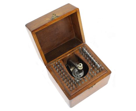 Star staking tool with accessories, within original wooden case 