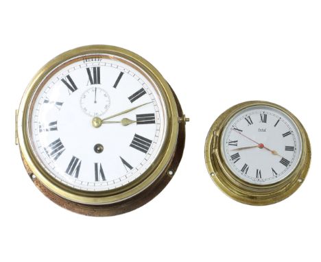 Ships bulkhead clock timepiece, the 6.5" white dial with subsidiary seconds dial and slow/fast adjustment, within a brass cas