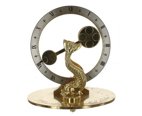 Dent &amp; Co mystery clock, the 7.5" silvered chapter ring fitted with a counterbalanced single hand upon dolphin supports a