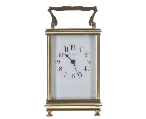 French carriage clock timepiece with 11 jewel movement, the dial signed Tiffany &amp; Co, France, within a brass case, 6" hig