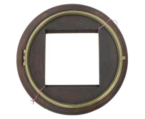 Large oak circular wall dial surround; also a hinged brass bezel with aperture for a 23" dial 
