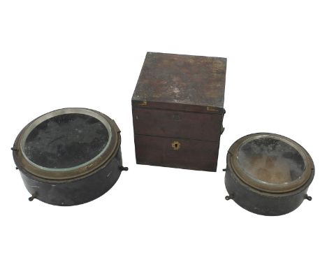 Old mahogany brass bound double hinged marine chronometer case; also two cast iron bulk head ship clock cases with apertures 
