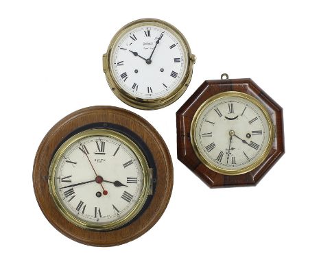 Smith eight day ships bulkhead wall clock, the 7" cream dial with slow/fast lever, within a brass bezel and blackened case mo