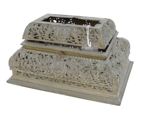 Early brass hinged basket top for a Georgian bracket clock, profusely pierced with cherubs and natives amidst scrolling folia