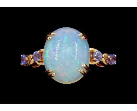 9ct rose gold single stone opal ring, with tanzanite set shoulders, hallmarkedCondition Report:Approx 2.8gm, size R-S, very g