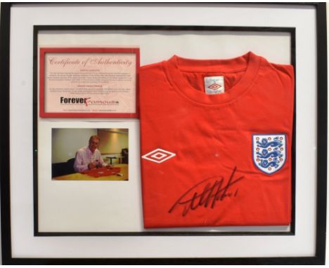 [FOOTBALL] GEOFF HURST, a signed England football shirt, with a colour photograph of a shirt being signed, framed as one, 39c