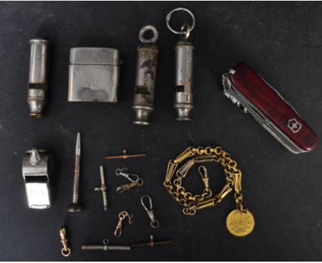 A collection of early 20th century and later gentlemen's items to include an assortment of whistles each with different marki
