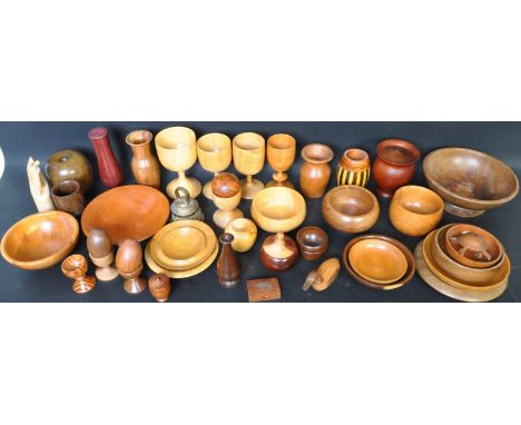 A large collection of 20th century carved turned wood treen items to include a Georgian style apple shaped tea caddy, olive w