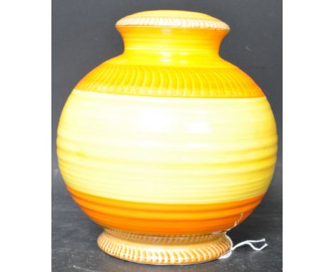 A vintage 20th Century Art Deco hand painted ceramic lamp base of bulbous form having a ribbed finished body with orange and 