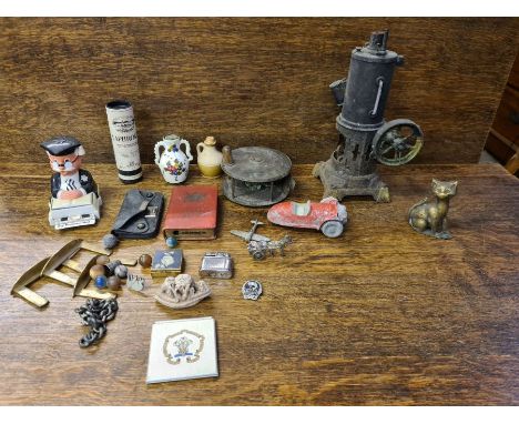 Mixed tray lot to include model steam engine, brass fly fishing reel, poker stand, soapstone figure, die cast car, etc.